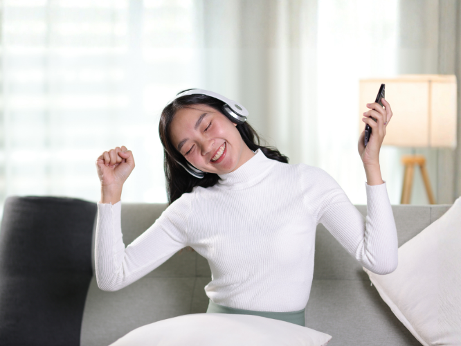 Young woman listening to music with headphones