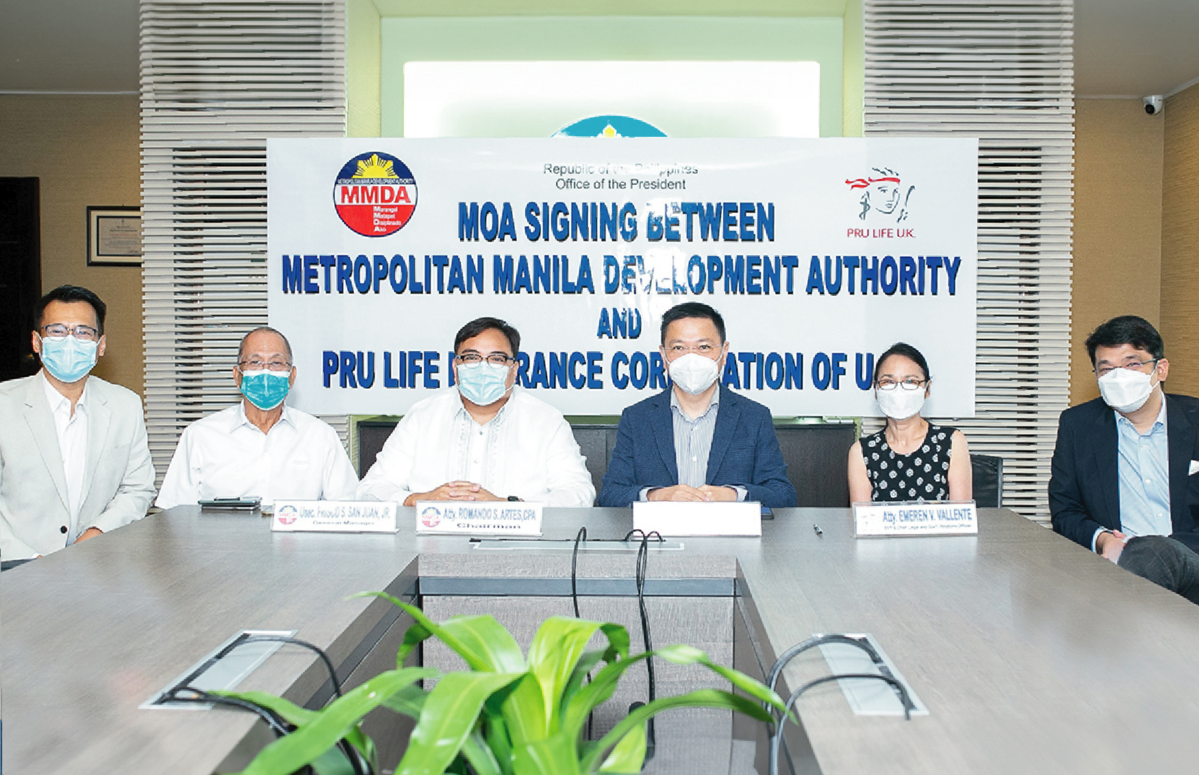 Pru Life UK and MMDA leaders shaking hands