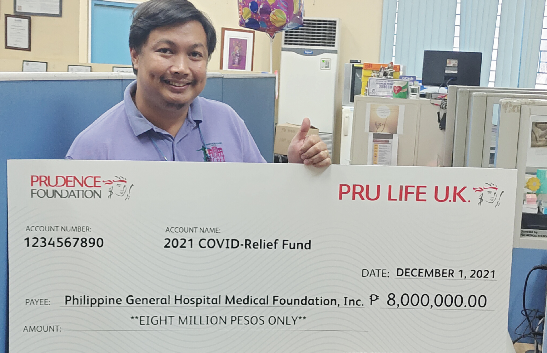 PGH Admin officer with Pru Life UK cheque