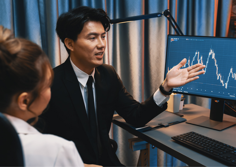 Colleagues reviewing stock market data