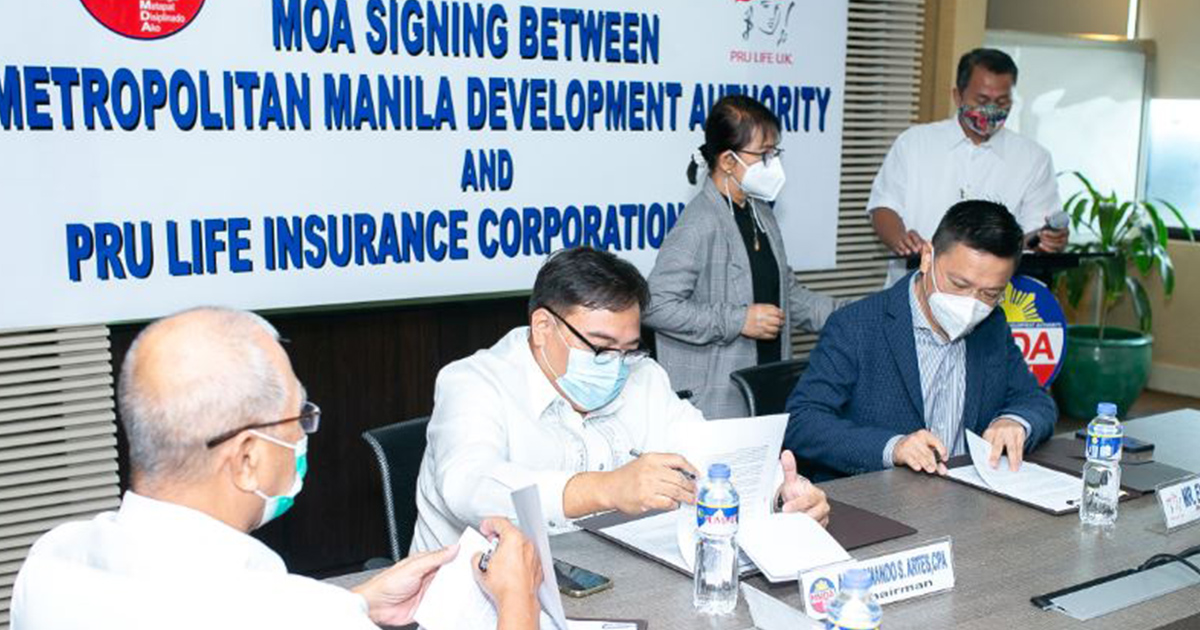 Pru Life UK and MMDA officials signing