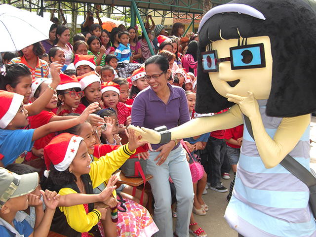 Happy kids interacting with a mascot