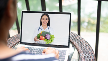 Girl eating salad at home