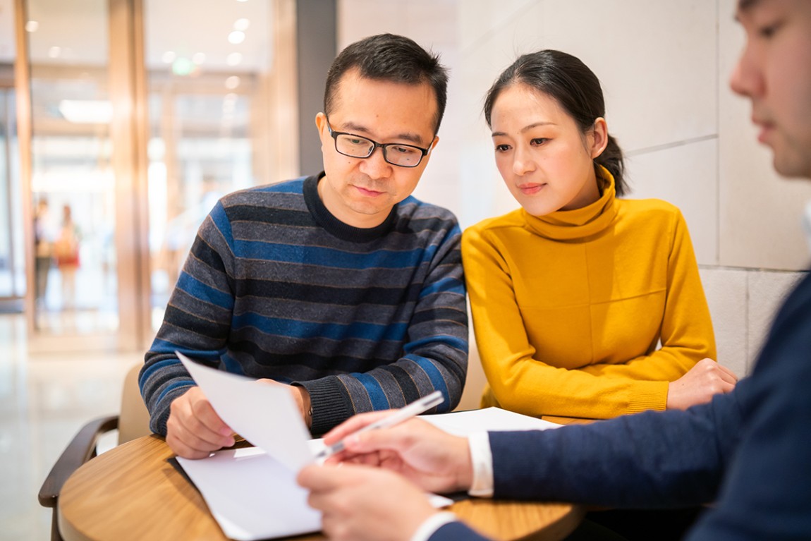 Financial advisor talking to a couple