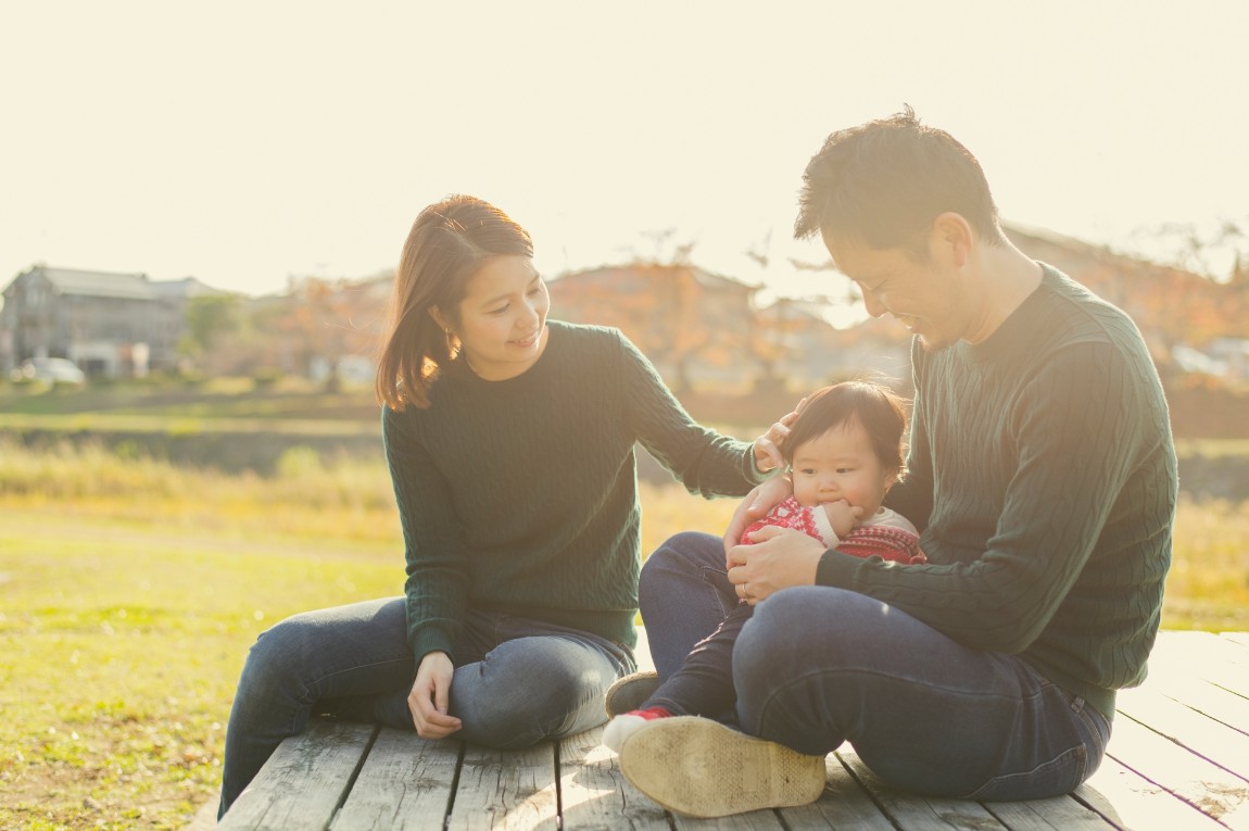 Happy family having a good time with baby girl