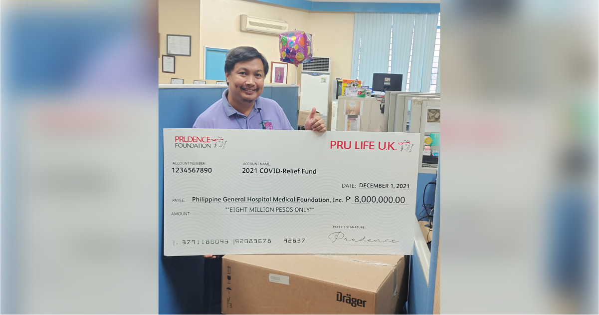 PGH Admin officer with Pru Life UK cheque
