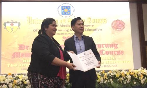 Mr. Wong receiving a certificate of appreciation