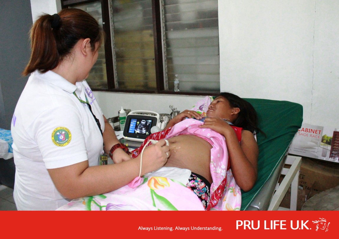 Pregnant woman getting scanned