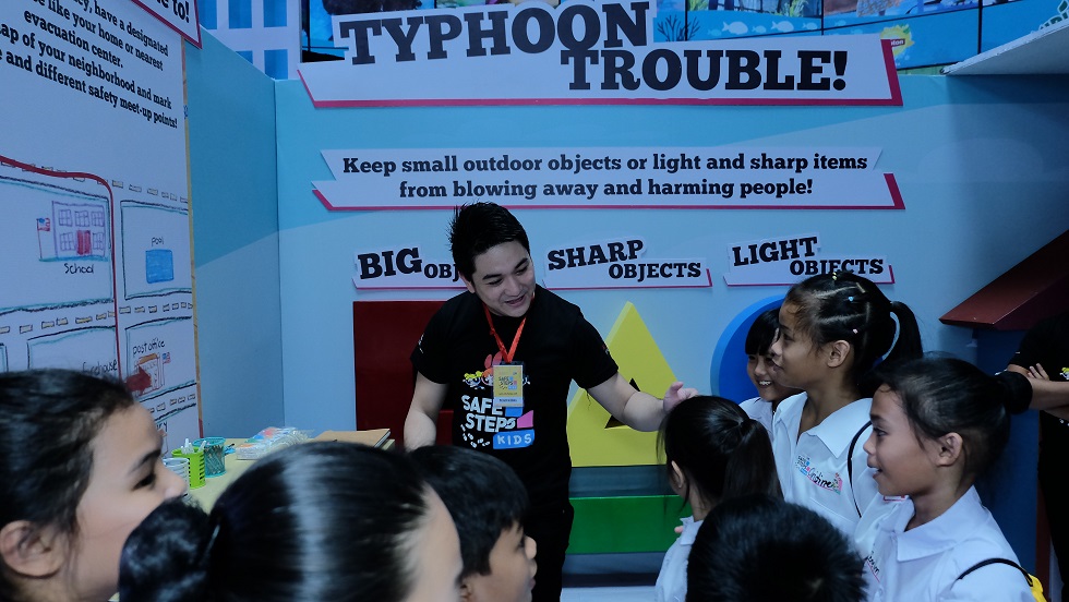 Children learning at the SAFE STEPS Kids booths