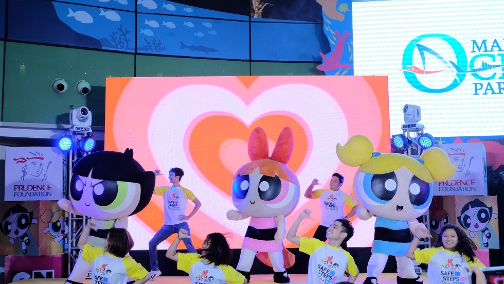 Powerpuff Girls mascots dancing on stage