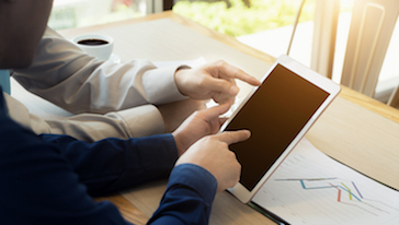 Two people using a tablet
