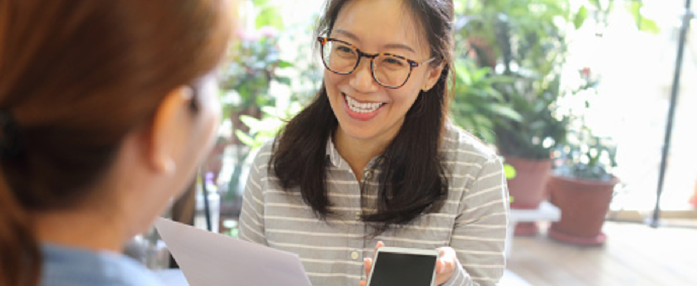 Woman comparing phones