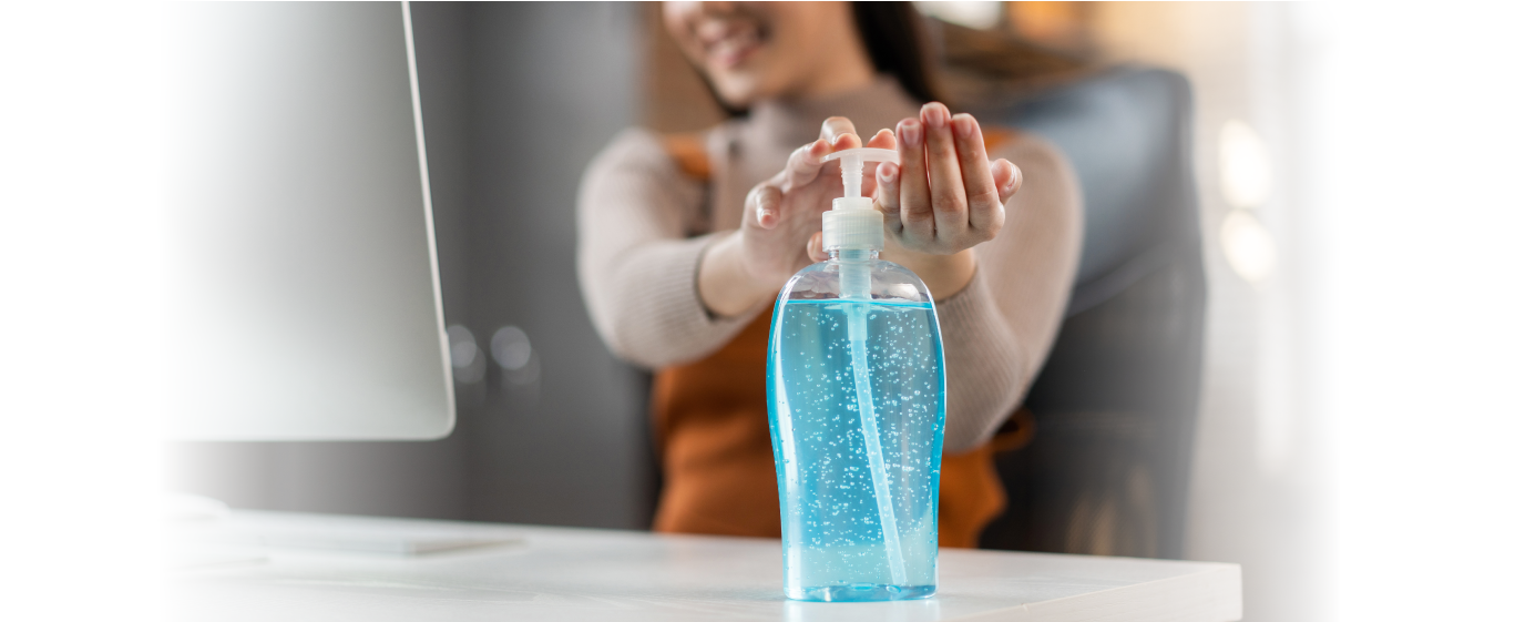 Woman sanitizing her hands